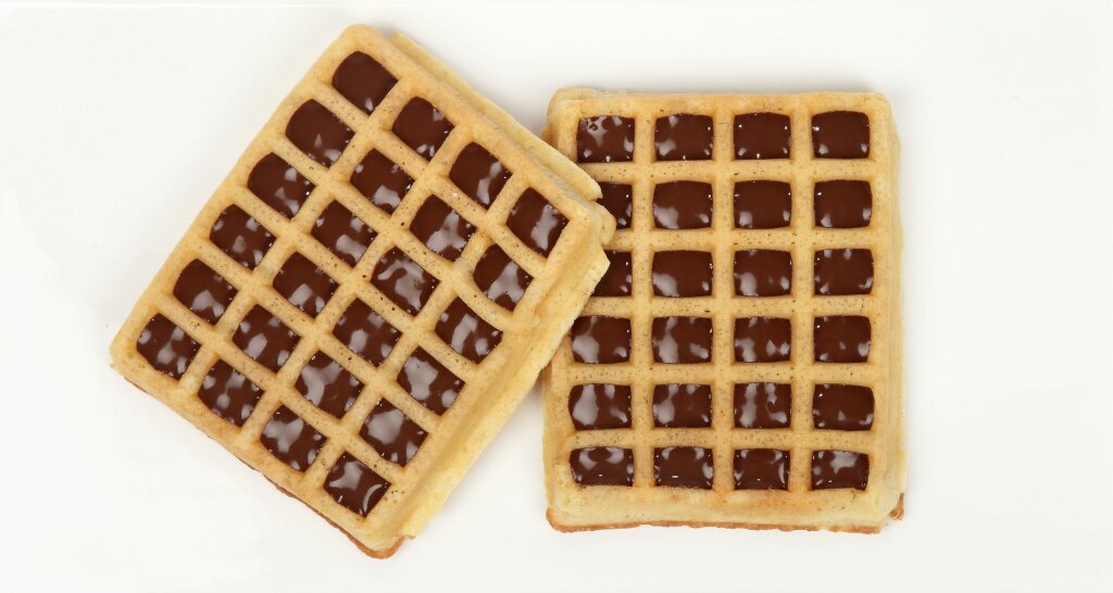 Two egg waffles with compound deposited in every cavity