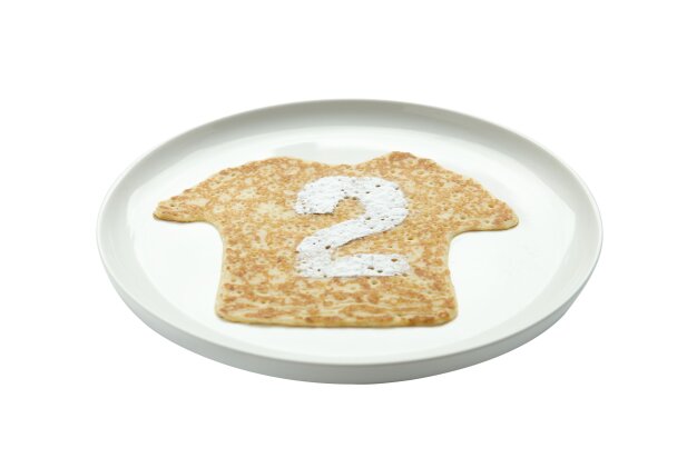 Pancake shaped as a football shirt with a white number 2, on a white plate