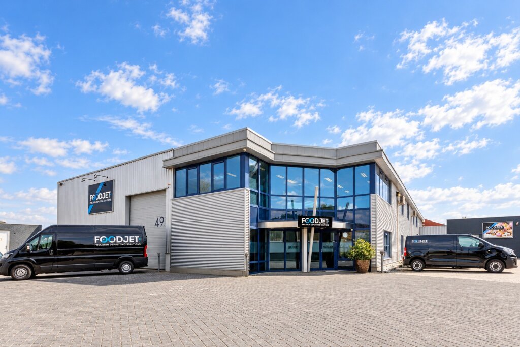 FoodJet headquarters on Ambachtsweg in Nijmegen, with two FoodJet vans parked in front