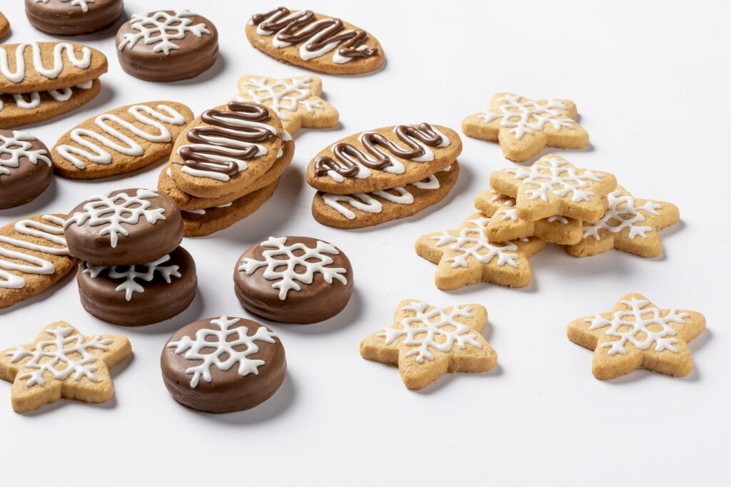 Assorted cookies with snowflake and wavy line patterns in white and dark chocolate